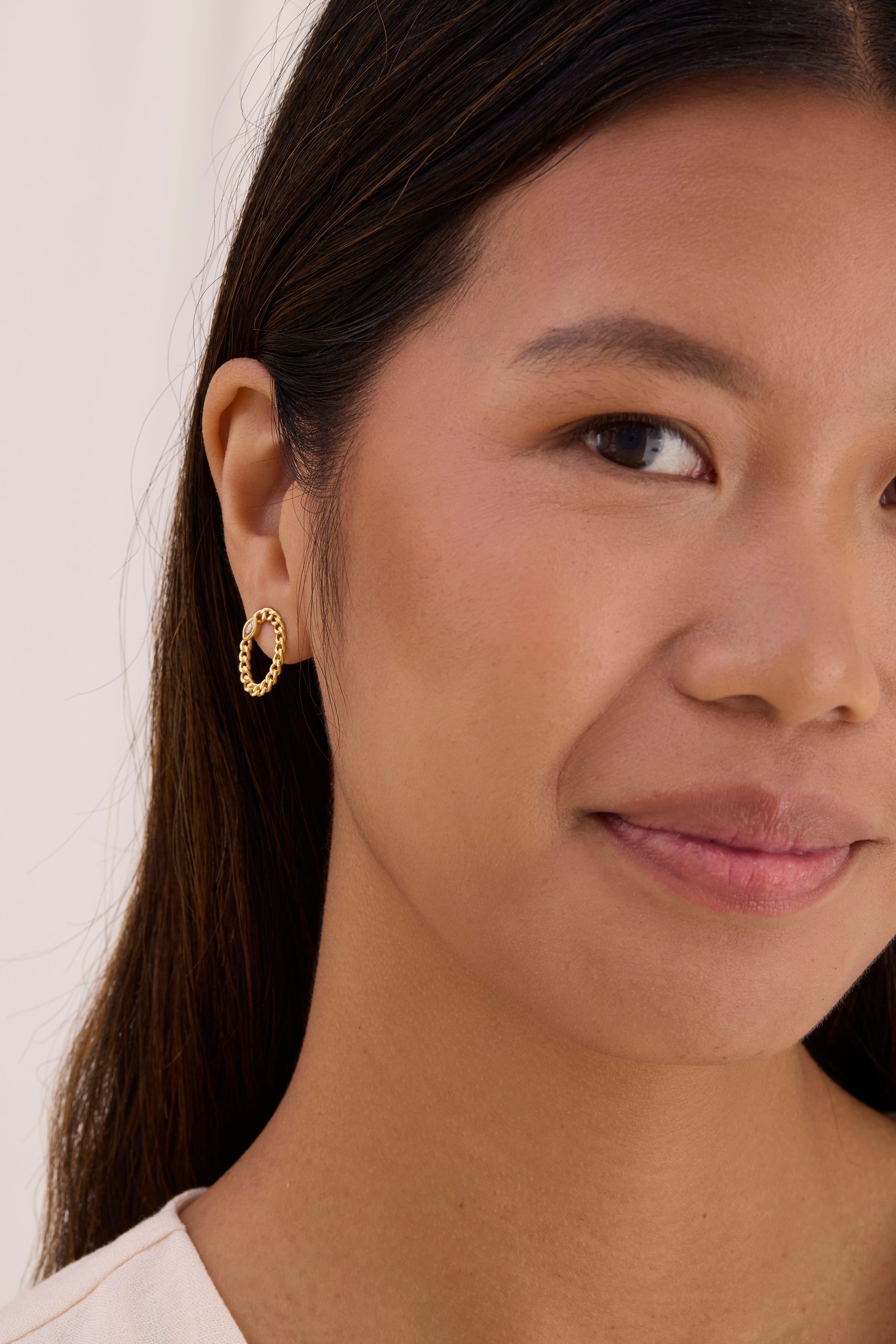 Gold curb chain oval shaped earring with marquise gemstone