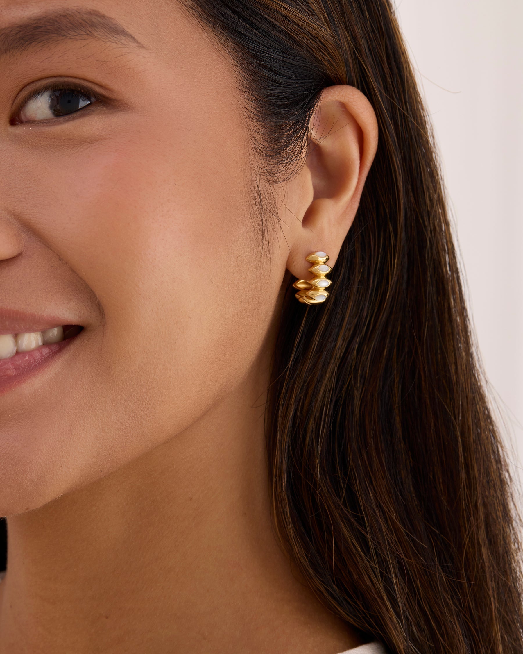 Pearl Hoops that are thick gold and reversible