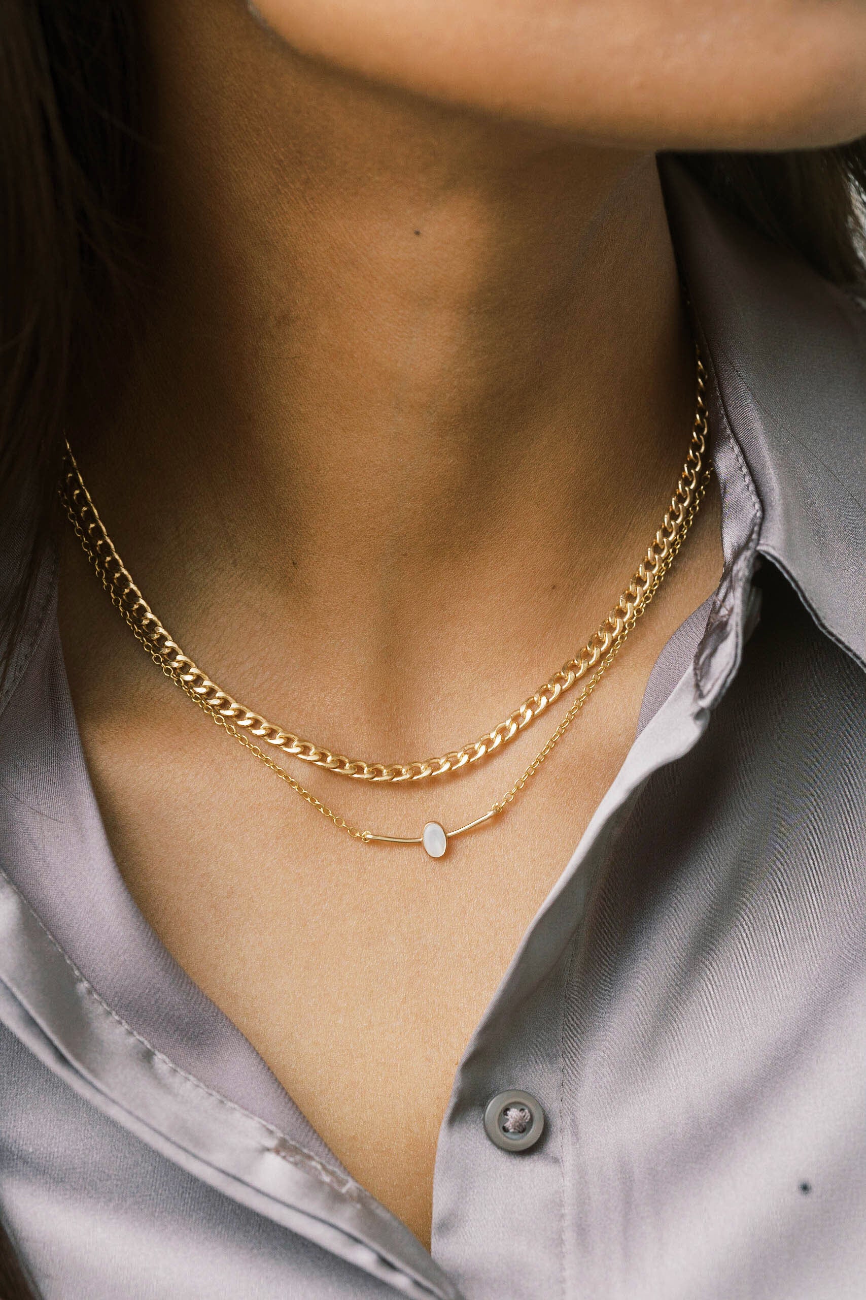 A gold curb chain is classic and timeless