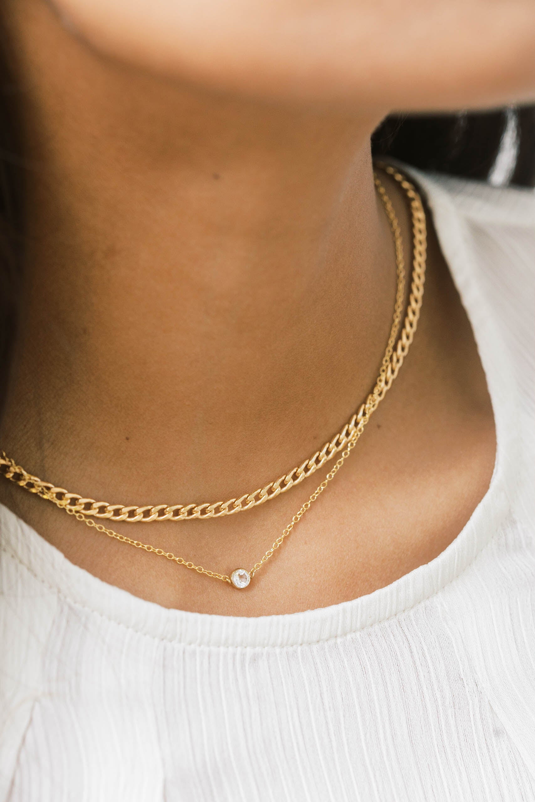 The gold curb chain is a classic chain necklace to wear alone or layer