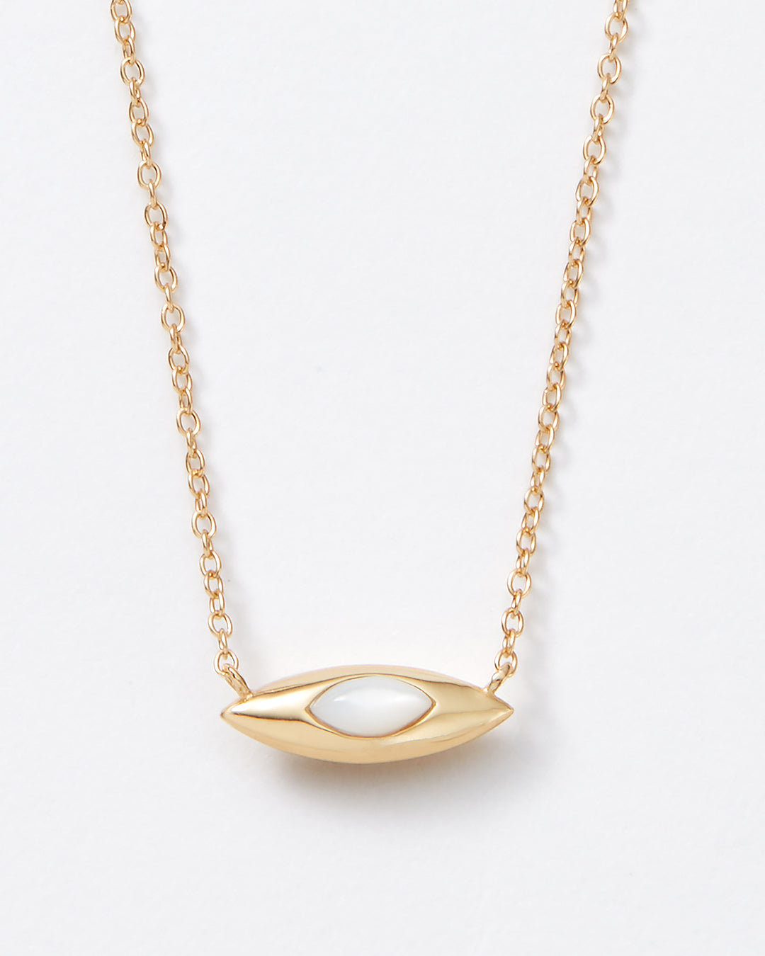 A gold chain necklace with a horizontal marquise pendant featuring a white oval mother of pearl inlay, photographed on a clean white background.
