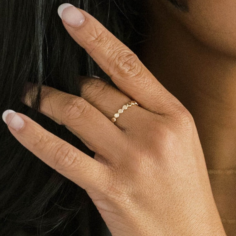 Gold ring with a dot pattern.
