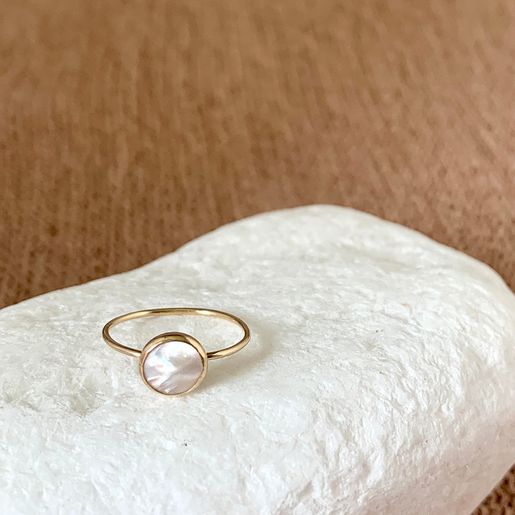 White pearl ring is simple and modern. Set in gold fill metal that is hypoallergenic and tarnish free.