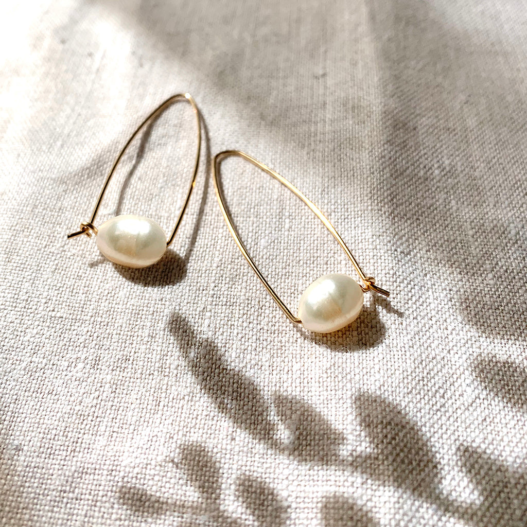 Freshwater pearl earrings are affordable, stylish and classic. Made with recycled gold, a very sustainable jewelry piece.