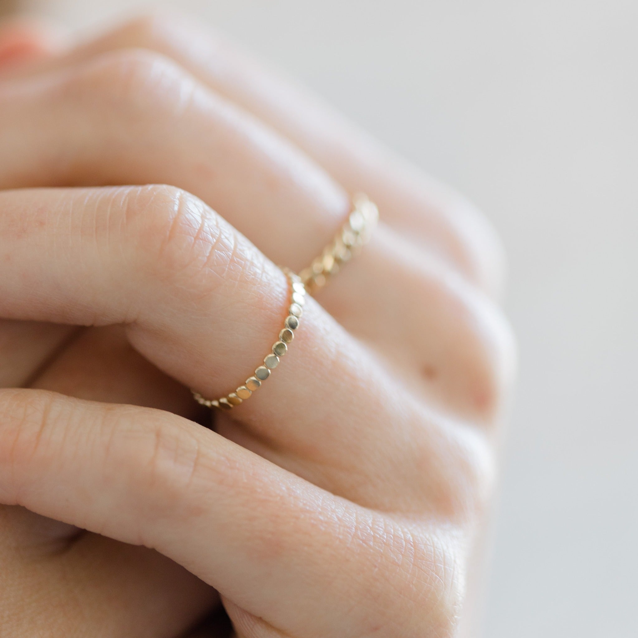 Lightweight gold dot ring made with durable 14k gold filled metal. The dot pattern glimmers in the light.