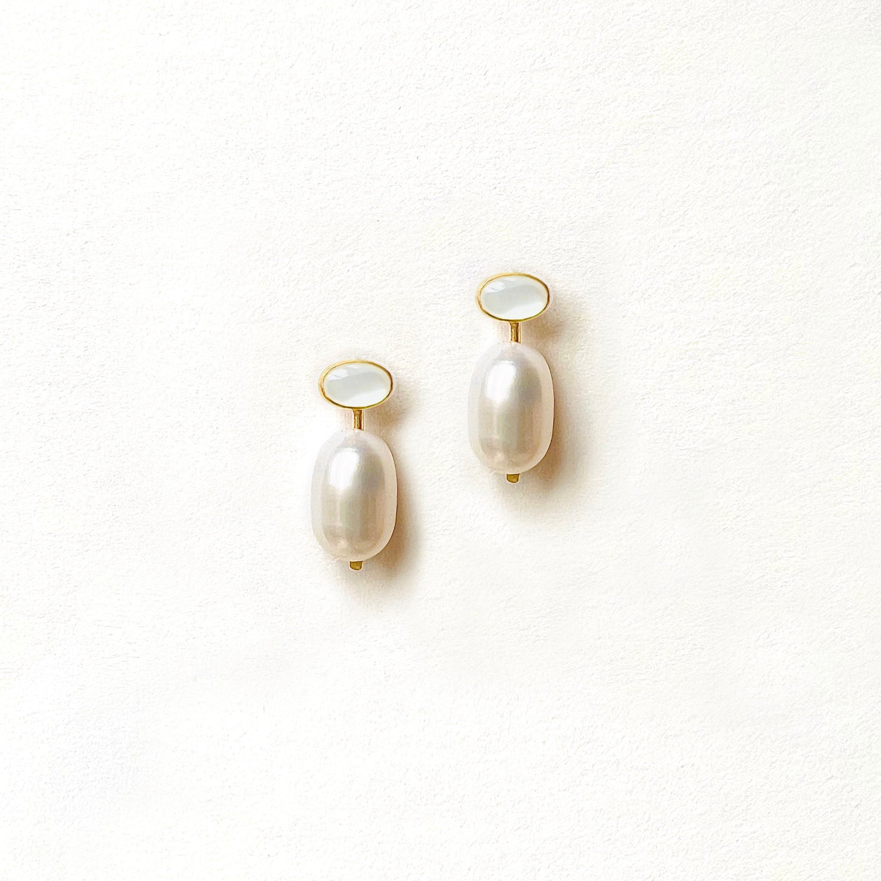 Double White Pearl Drop Earrings with an oval shape