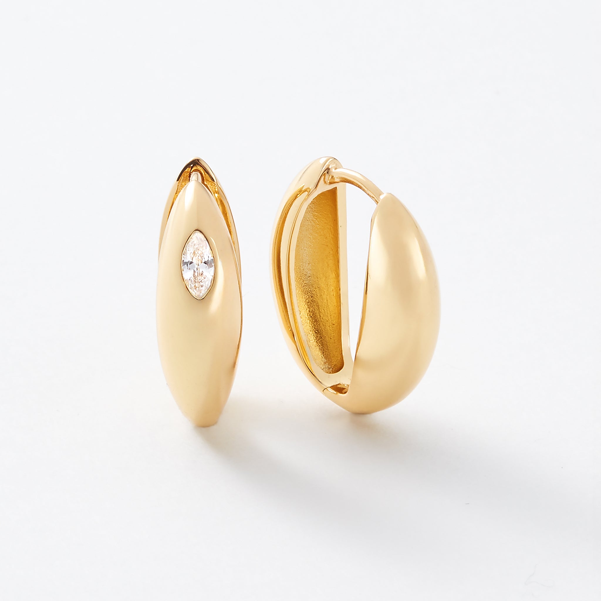 Gold thick dome like petal earrings. Reversible hoops.