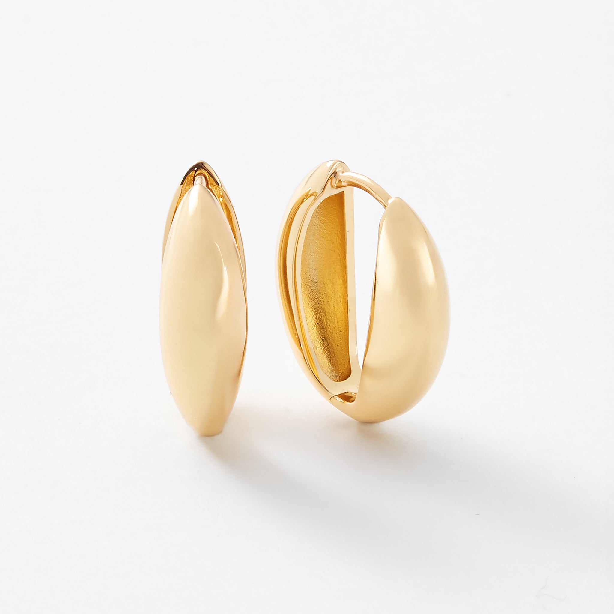 Thick gold hoop earrings.