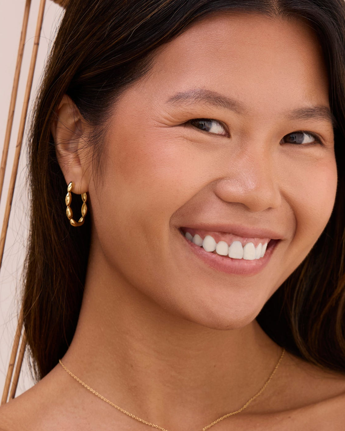 Gold beaded large hoop earrings. Hinge hoop earrings that are double sided