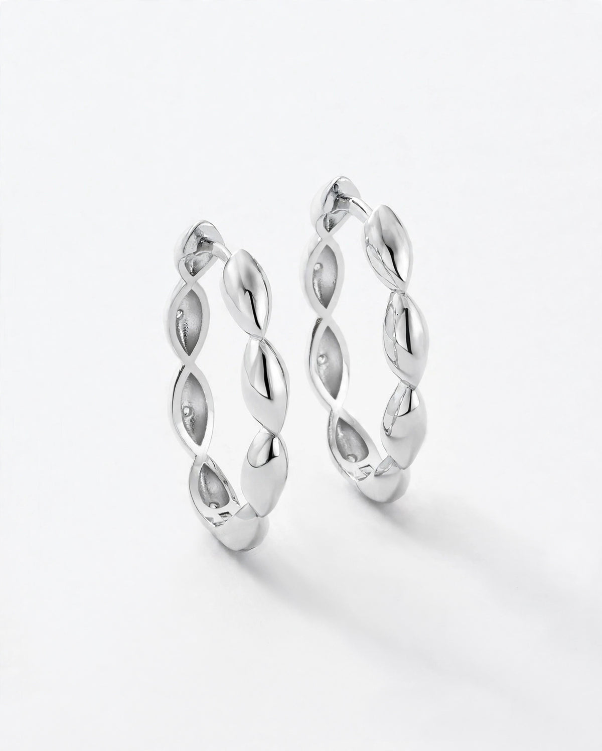 Sterling silver hoop earrings. Click style. smooth polished silver.
