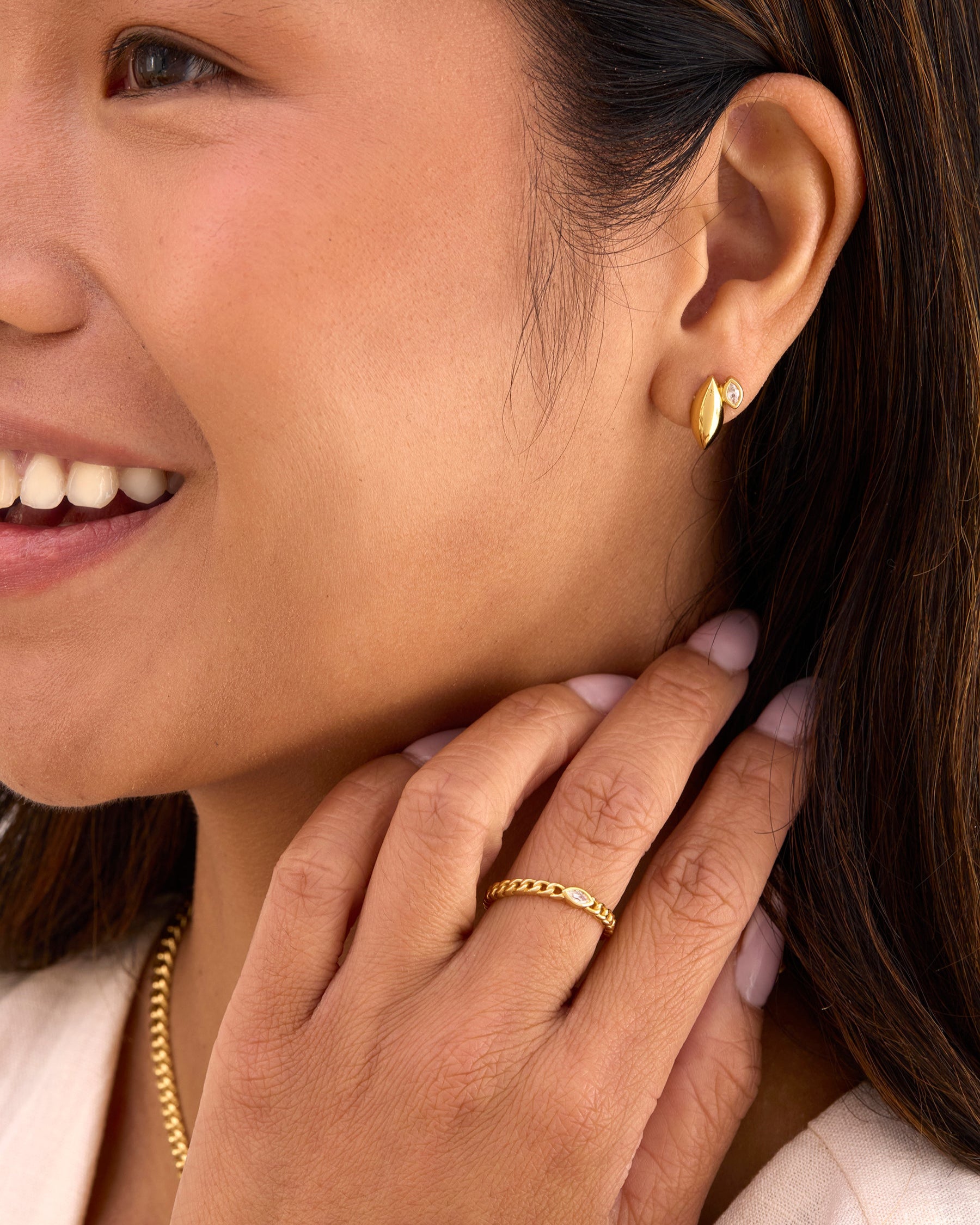 Gold curb chain ring with marquise gemstone