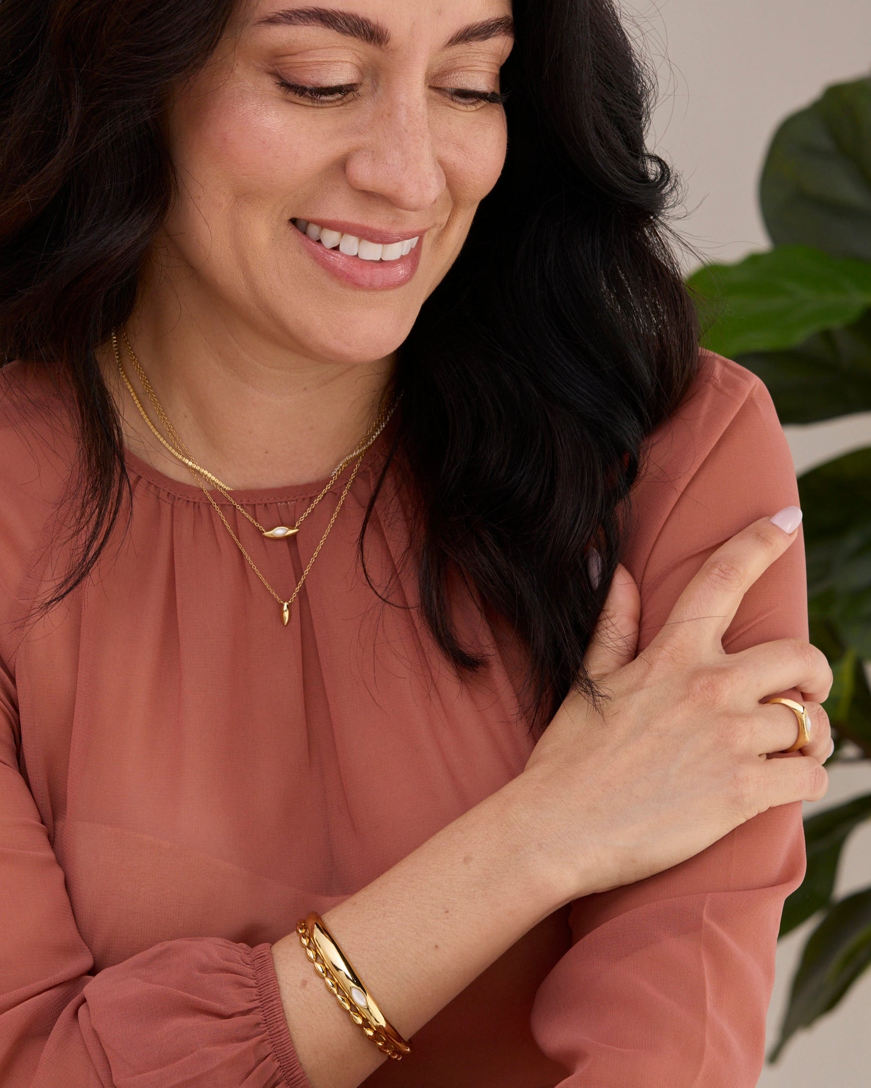 Two gold vermeil cuff bracelets stacked together