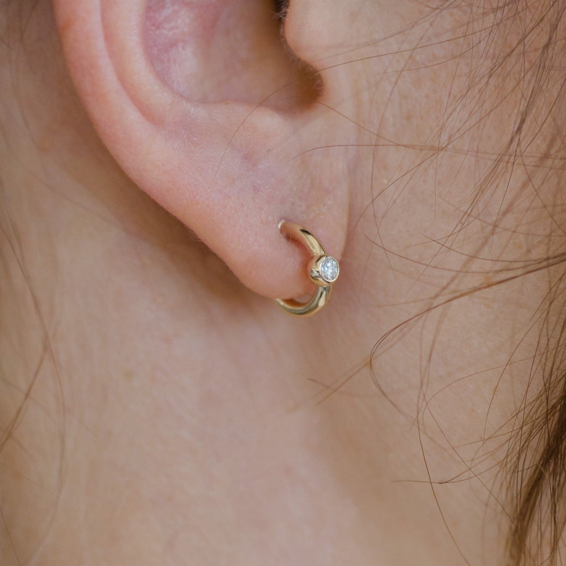 Sweet, small and elegant round diamond hoop earrings.