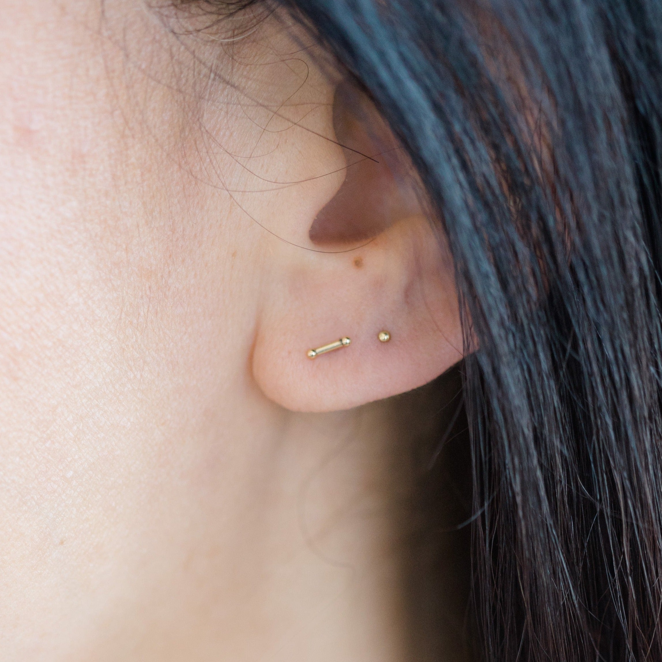 the super simple silhouette of this gold bar earring is sure to be a forever favorite. 
