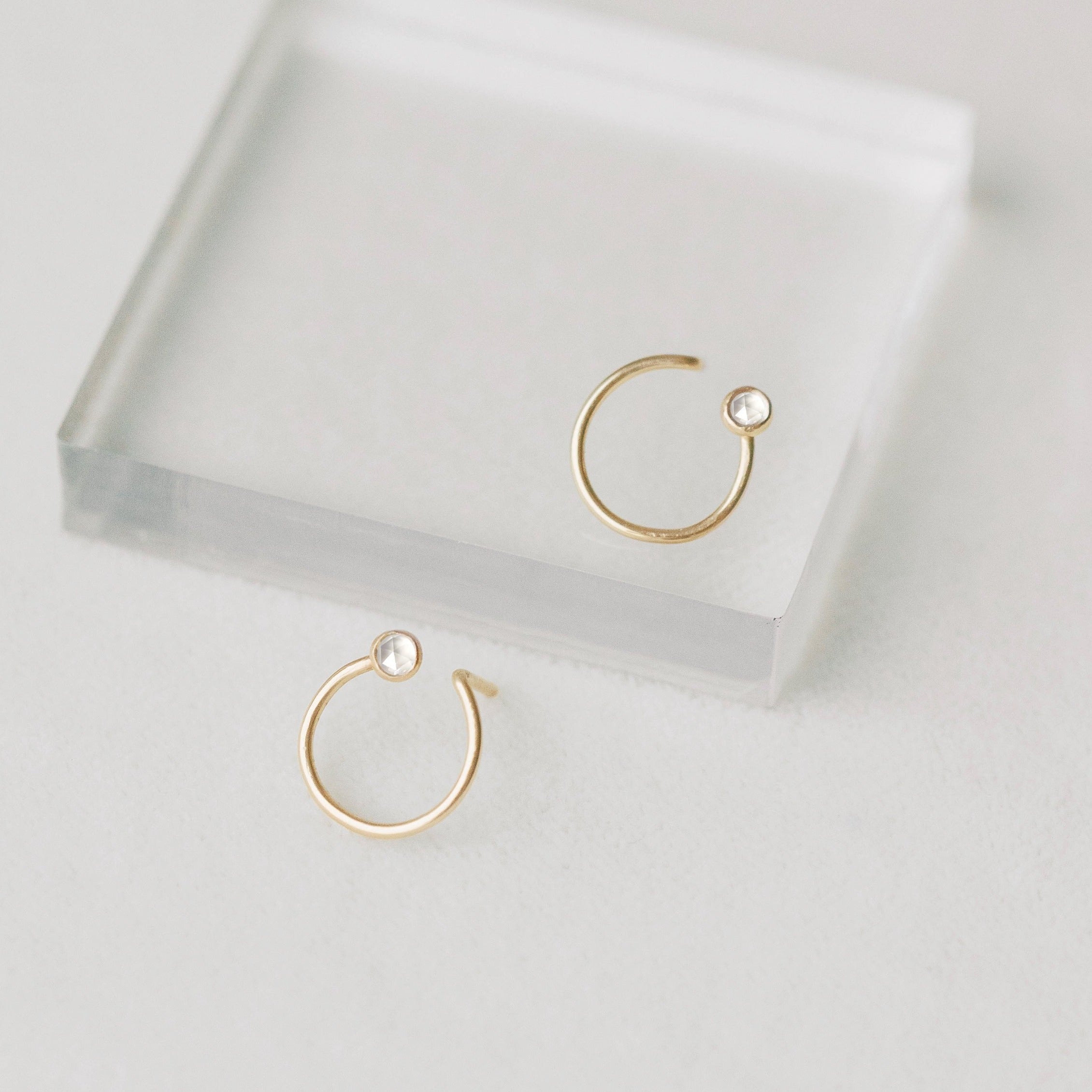 Tiny gold circle earrings made with recycled gold
