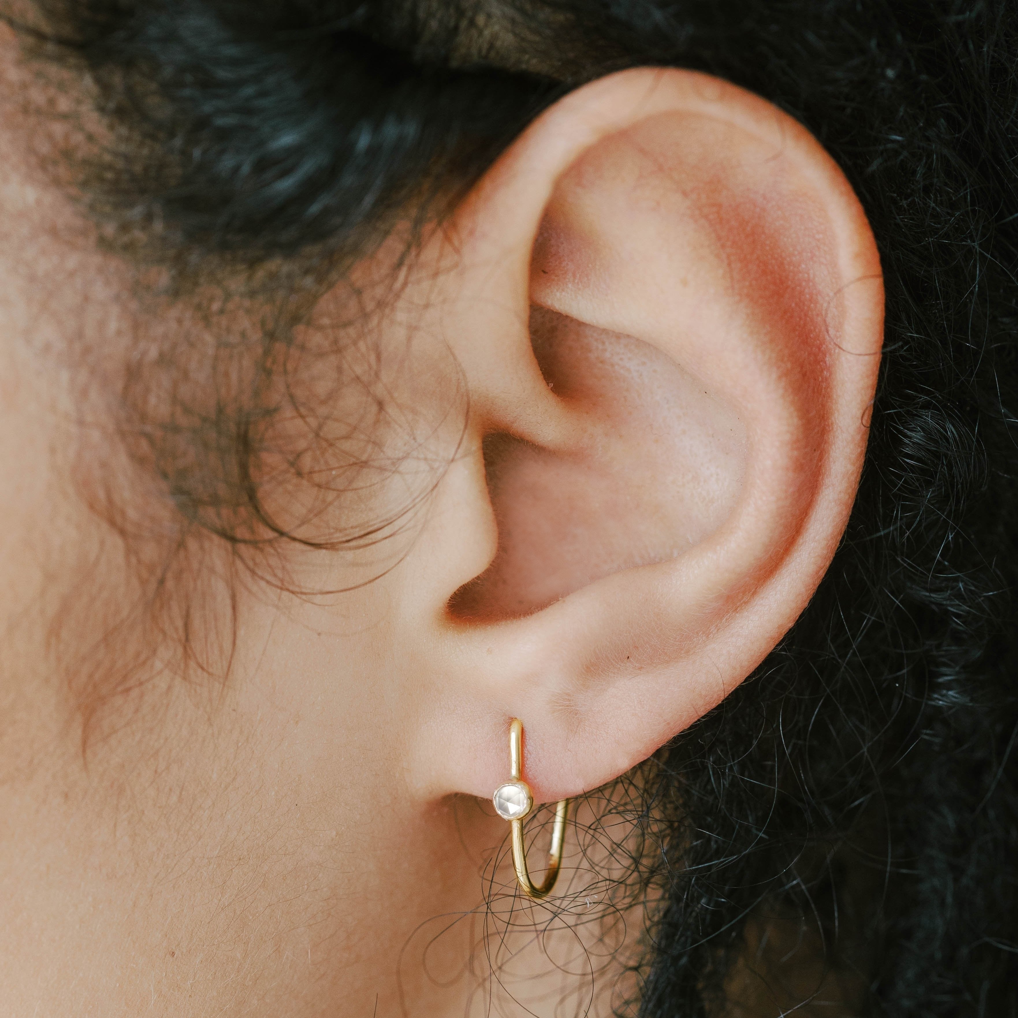 Dainty small gold hoops made from recycled gold.