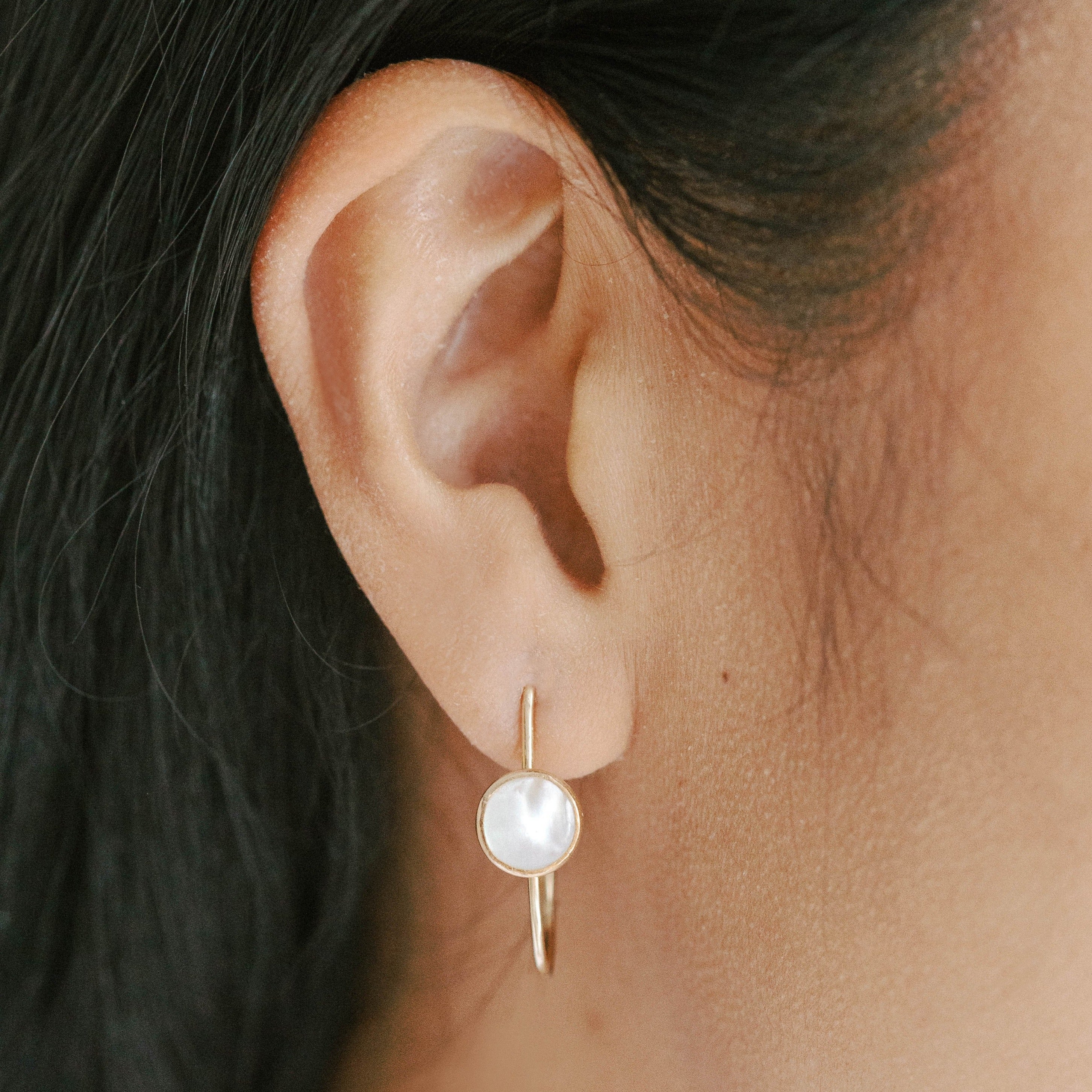 Lightweight gold hoop earrings with pearls. Mother of pearl design that is modern.