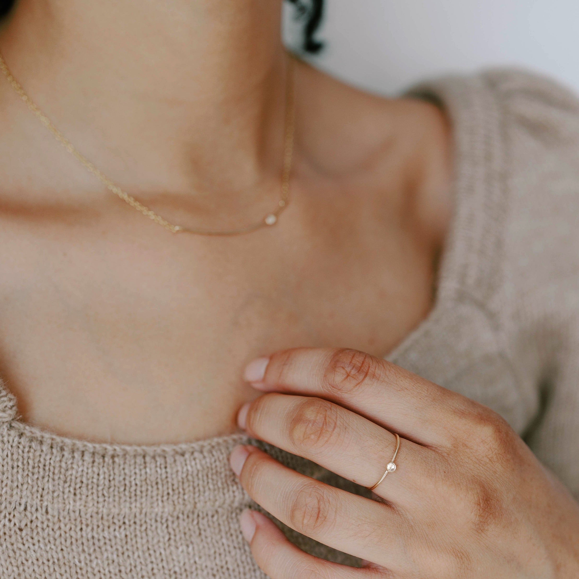 Minimal gold bar necklace with white topaz