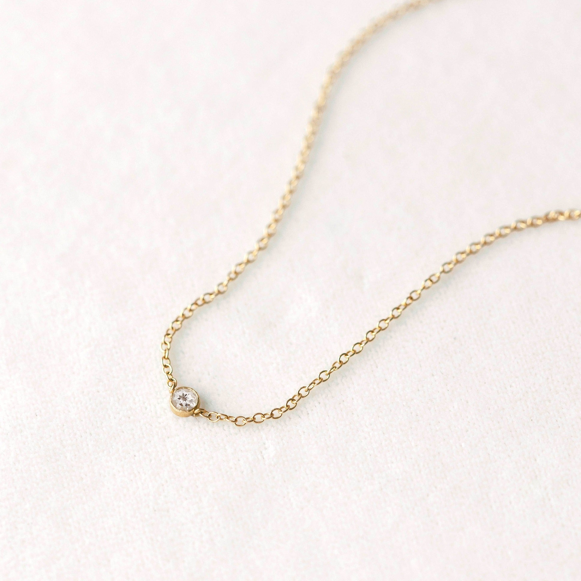 Tiny white topaz gemstone pendant