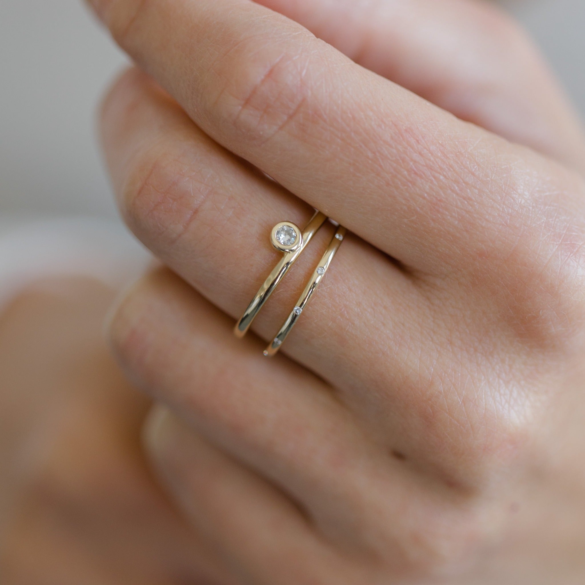 Stack you eternity band with other diamond rings. This sleek little eternity band is delicate, thin but very eye catching. It's elegant for everyday.