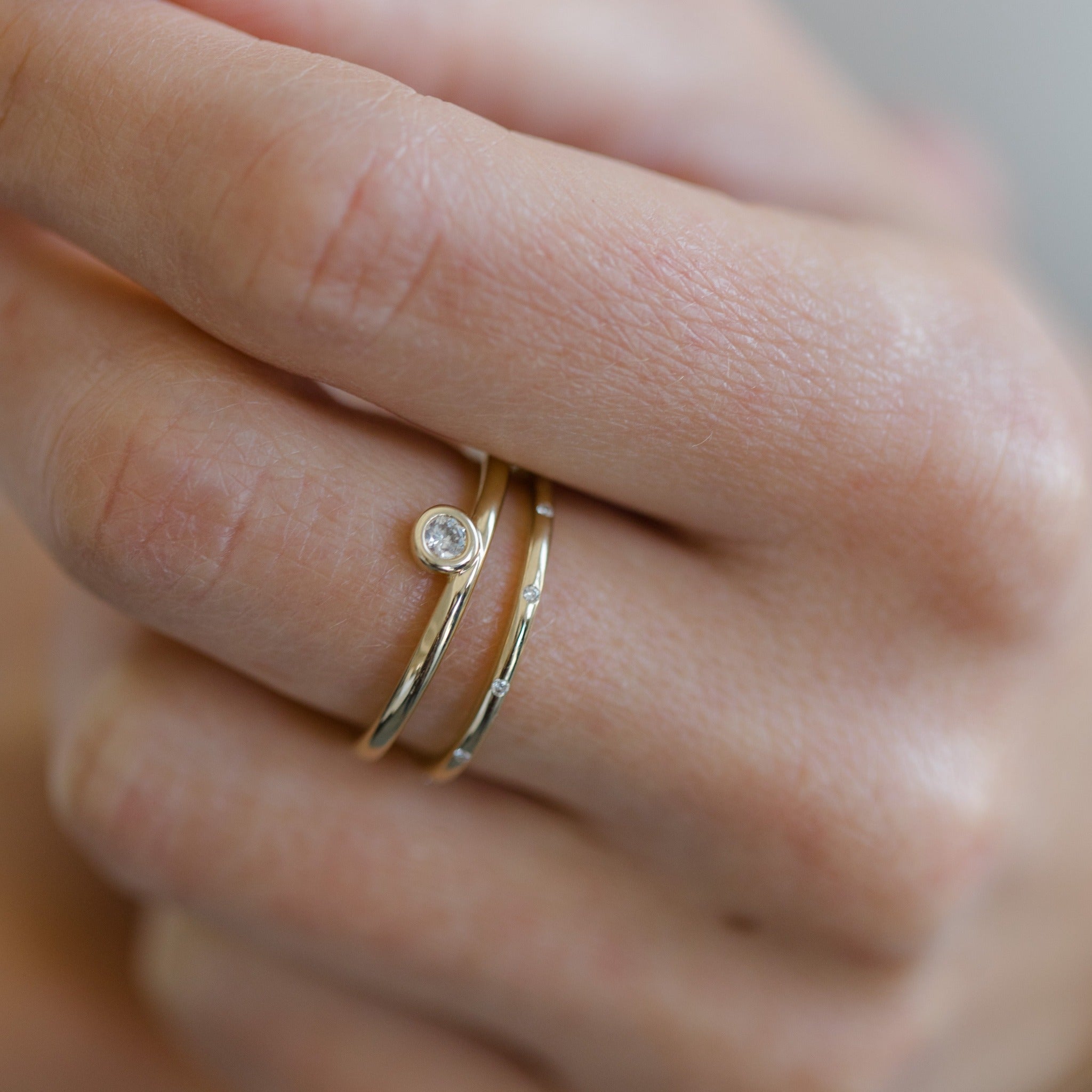It can also be stacked with other diamond rings. It is a simple and modern diamond ring that works well stacking with other ring styles. Made with recycled 14k yellow gold.