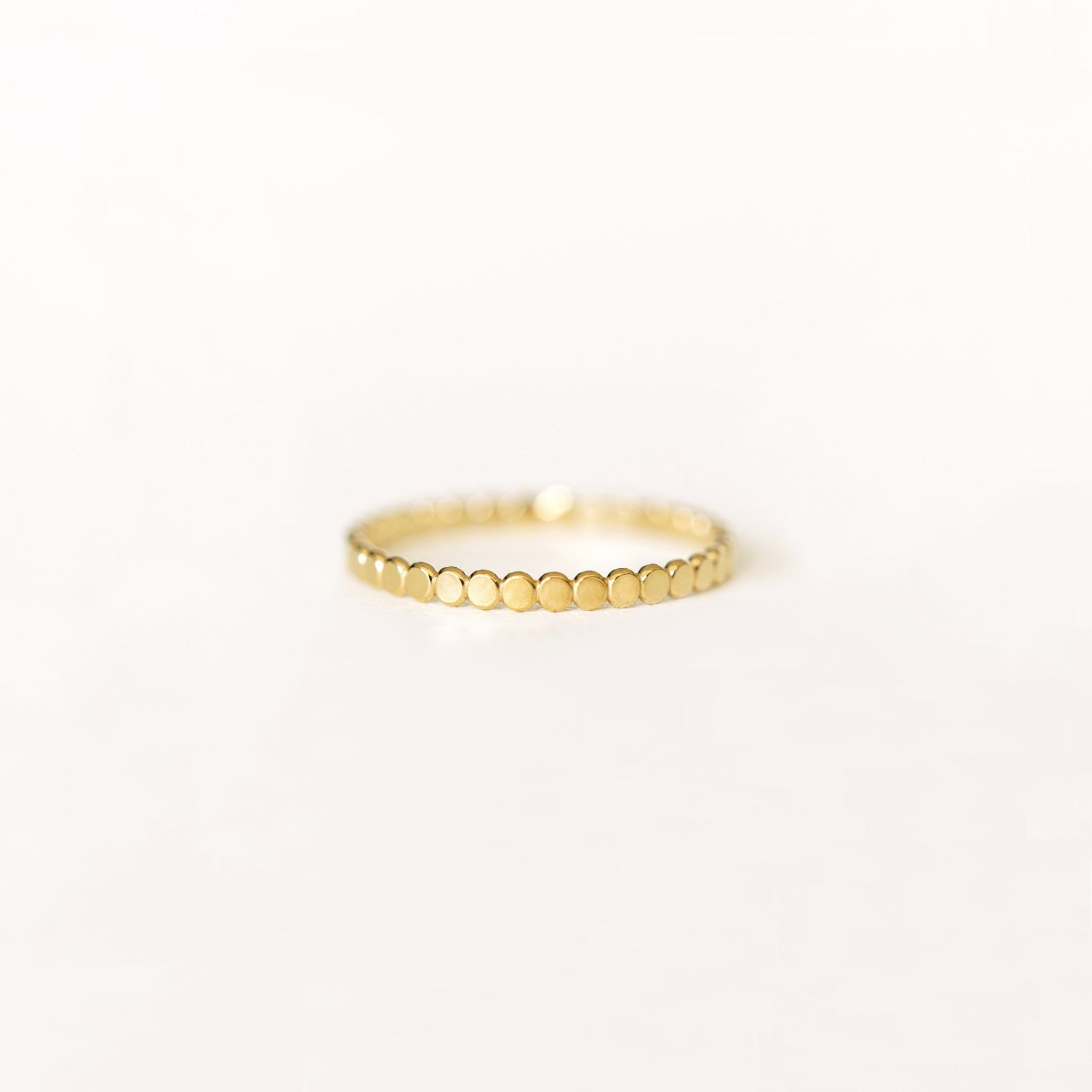 Thin delicate gold ring with tiny dot pattern. Made with recycled 14k gold filled metal.